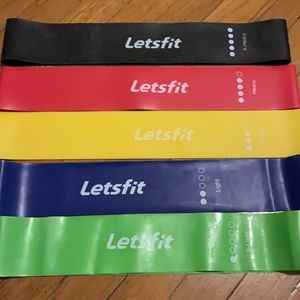 Yoga mat with set of exercise bands.